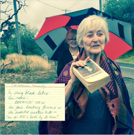Image of a participant sharing the collection of Gertrude Stein’s writing that she carried on the Walking Library for Women Walking walk in Geelong (Australia), 16 November 2017
