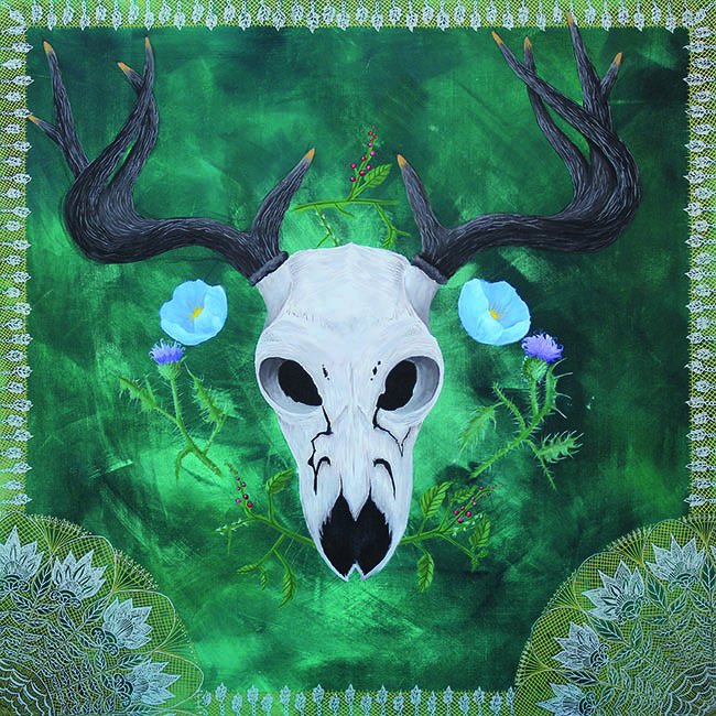 Stag skull on bordered green floral background.